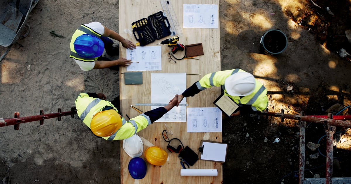 Construction professionals collaborating on building project